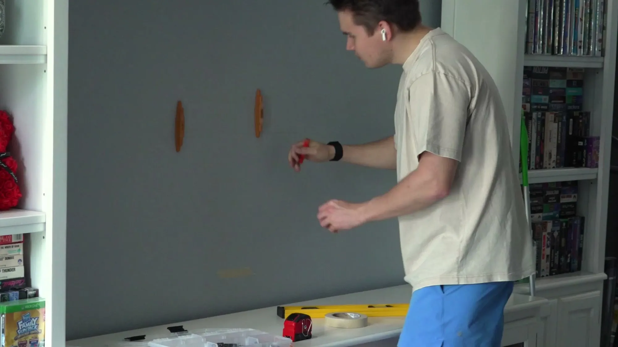 Installer marking stud positions on a living-room wall